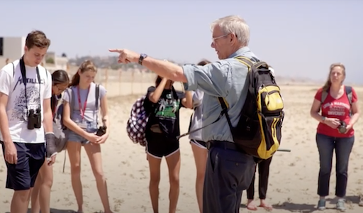 Students in Summer Program for Environmental Science. Students are at the beach with a professor.